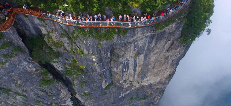 Tiptoe Along A Dangerously Thin Glass Bridge Suspended 4,700 Feet Up China’s “Avatar” Mountain